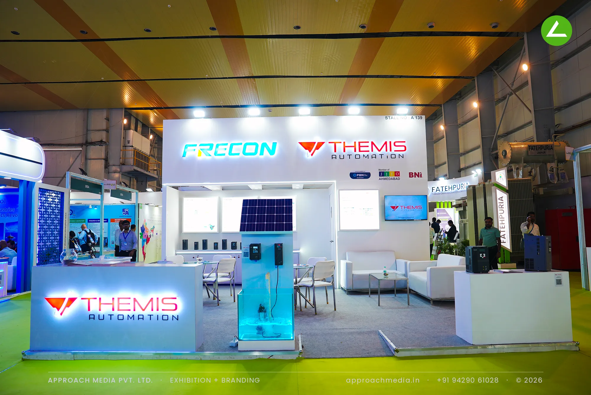 Exhibition stall design at REI Greater Noida: Themis Automation stand with a working solar pump in a glass tank